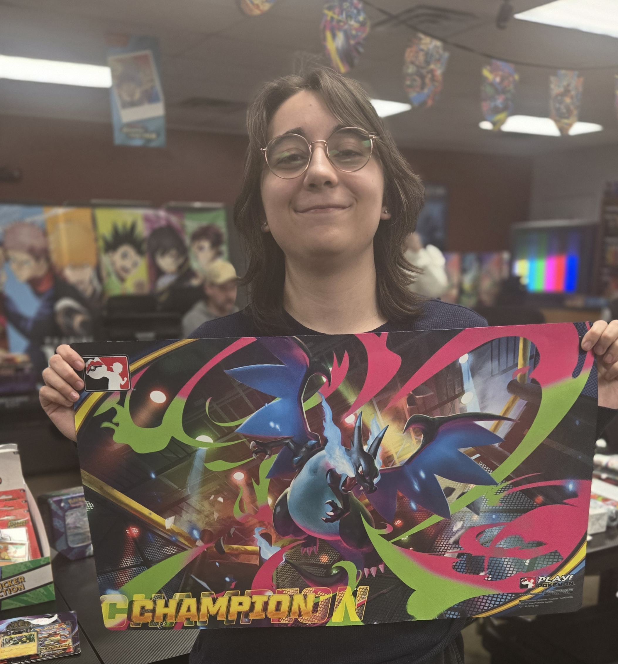 Alyssa Gilman holding their Champ Map